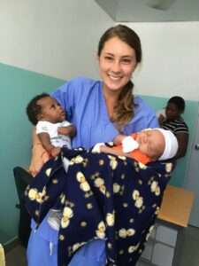 Volunteer with babies 1