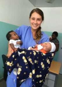 Volunteer with babies